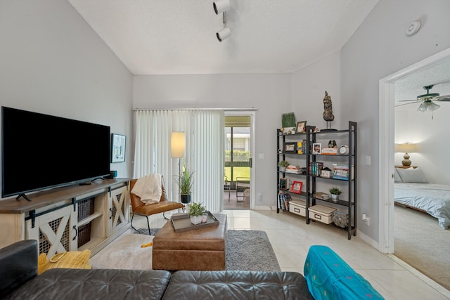 3809 Island Club Cir E, Lake Worth, FL 33462 - living area with tile patterned flooring, a ceiling fan, track lighting, and a textured ceiling
