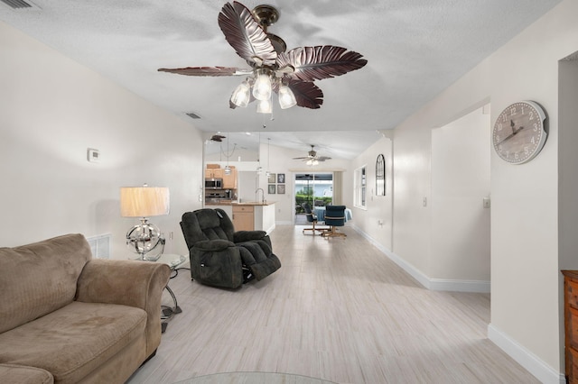 5647 SE Sailfish Way, Stuart, FL 34997 - living room featuring light wood finished floors and ceiling fan
