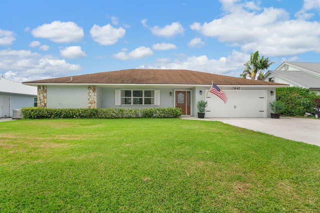 5647 SE Sailfish Way, Stuart, FL 34997 - single story home featuring a garage, a front lawn, driveway, and stucco siding