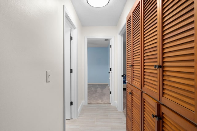 5647 SE Sailfish Way, Stuart, FL 34997 - corridor featuring baseboards