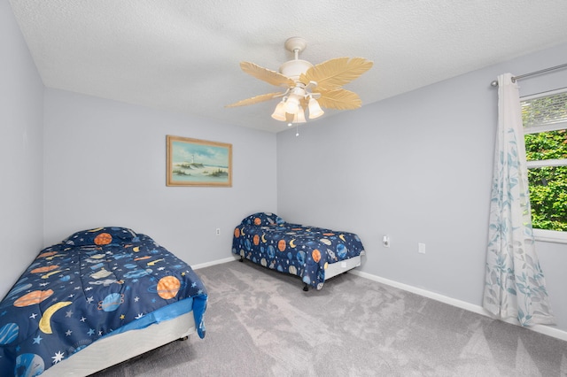 5647 SE Sailfish Way, Stuart, FL 34997 - bedroom with carpet flooring, a ceiling fan, and a textured ceiling