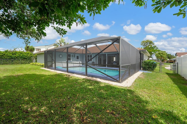 5647 SE Sailfish Way, Stuart, FL 34997 - back of house featuring a fenced backyard and a lanai