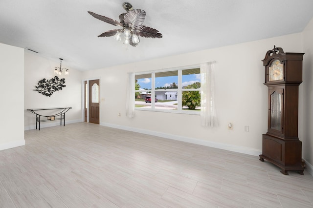 5647 SE Sailfish Way, Stuart, FL 34997 - unfurnished living room featuring a chandelier and ceiling fan