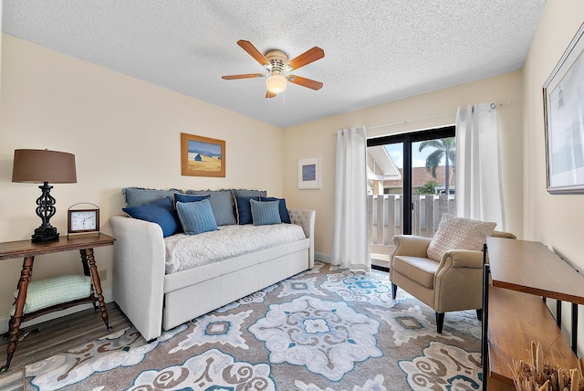 3733 Cape Pointe Cir, Jupiter, FL 33477 - living area featuring ceiling fan, a textured ceiling, and wood finished floors