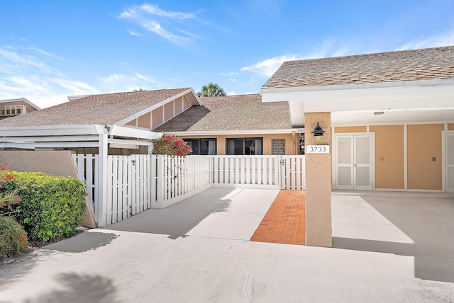 3733 Cape Pointe Cir, Jupiter, FL 33477 - view of road featuring a gate
