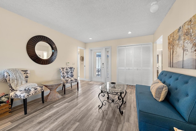 3733 Cape Pointe Cir, Jupiter, FL 33477 - living room featuring wood finished floors, a textured ceiling, and recessed lighting