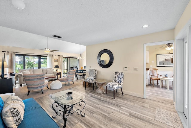 3733 Cape Pointe Cir, Jupiter, FL 33477 - living room featuring a textured ceiling, light wood-style flooring, ceiling fan, and recessed lighting
