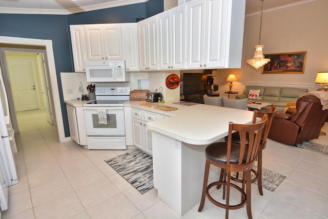 715 SW Balmoral Trce, Stuart, FL 34997 - kitchen featuring white appliances, ornamental molding, open floor plan, a peninsula, and white cabinetry