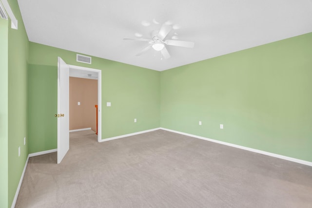 5693 SE Windsong Ln Unit 545, Stuart, FL 34997 - carpeted empty room with a ceiling fan and baseboards