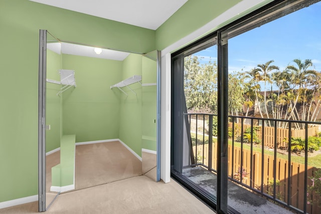 5693 SE Windsong Ln Unit 545, Stuart, FL 34997 - doorway with carpet and baseboards