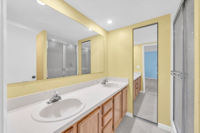 5693 SE Windsong Ln Unit 545, Stuart, FL 34997 - full bath featuring double vanity, a shower stall, and recessed lighting