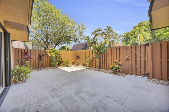 5693 SE Windsong Ln Unit 545, Stuart, FL 34997 - fenced backyard with a patio