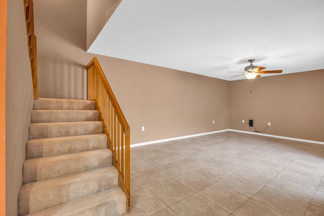 5693 SE Windsong Ln Unit 545, Stuart, FL 34997 - stairway featuring ceiling fan and tile patterned flooring