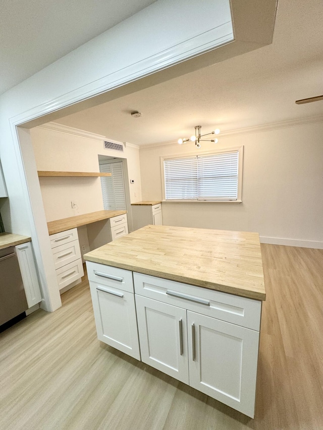 330 Saxony G 330, Delray Beach, FL 33446 - kitchen with wooden counters, ornamental molding, light wood-style flooring, open shelves, and white cabinets