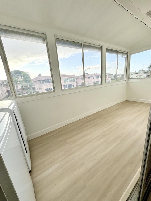 330 Saxony G 330, Delray Beach, FL 33446 - unfurnished sunroom featuring healthy amount of natural light and wood finished floors