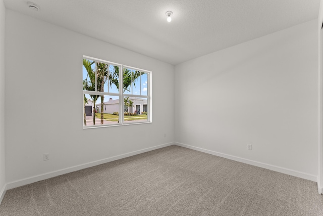 13566 SW Bally Dr, Port Saint Lucie, FL 34987 - carpeted spare room with a smoke detector and baseboards