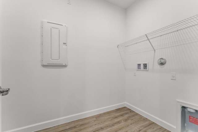 9555 SW Indra Way, Port Saint Lucie, FL 34987 - laundry room with hookup for an electric dryer, light wood-type flooring, gas dryer hookup, and hookup for a washing machine