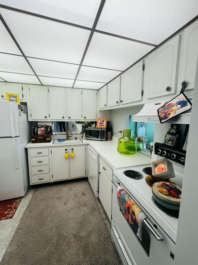 500 Executive Center Dr Unit 3F, West Palm Beach, FL 33401 - kitchen featuring white appliances, light countertops, and a drop ceiling