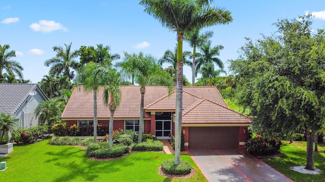 6572 Brookhurst Cir, Lake Worth, FL 33463 - view of front of house with a tiled roof, a garage, a front yard, concrete driveway, and stucco siding