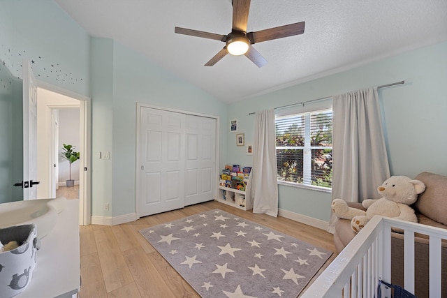 6572 Brookhurst Cir, Lake Worth, FL 33463 - bedroom featuring light wood-type flooring, vaulted ceiling, a closet, and ceiling fan