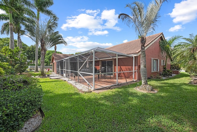 6572 Brookhurst Cir, Lake Worth, FL 33463 - rear view of property with a tile roof, a yard, a patio, and a lanai