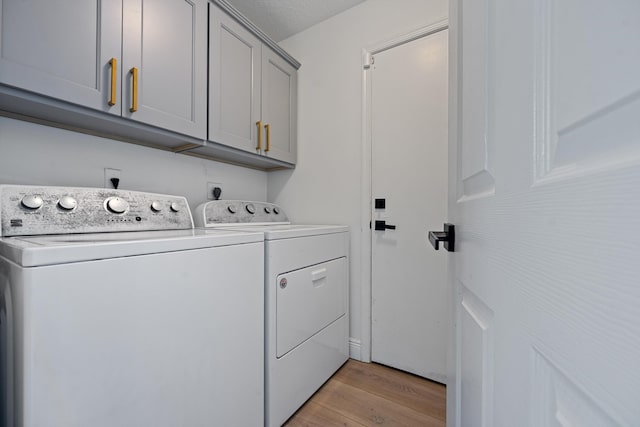 6572 Brookhurst Cir, Lake Worth, FL 33463 - laundry area featuring independent washer and dryer, cabinet space, and light wood-style flooring