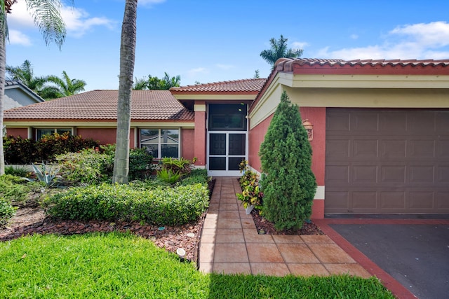 6572 Brookhurst Cir, Lake Worth, FL 33463 - view of front facade with a tile roof, stucco siding, and an attached garage