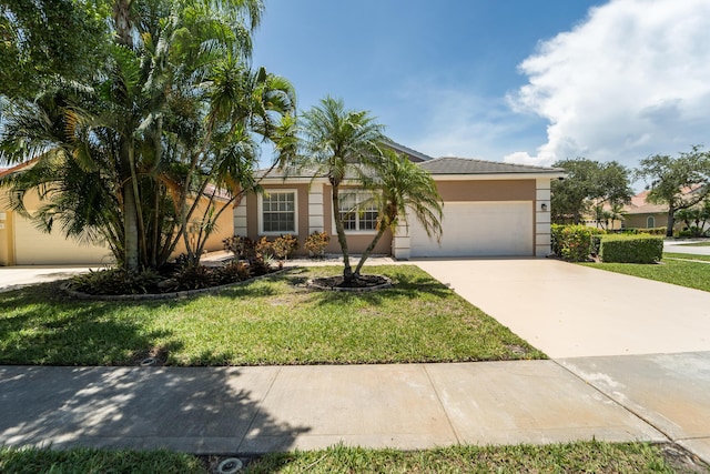 3002 SE Brierwood Pl, Stuart, FL 34997 - view of front of house with driveway, stucco siding, a garage, and a front lawn