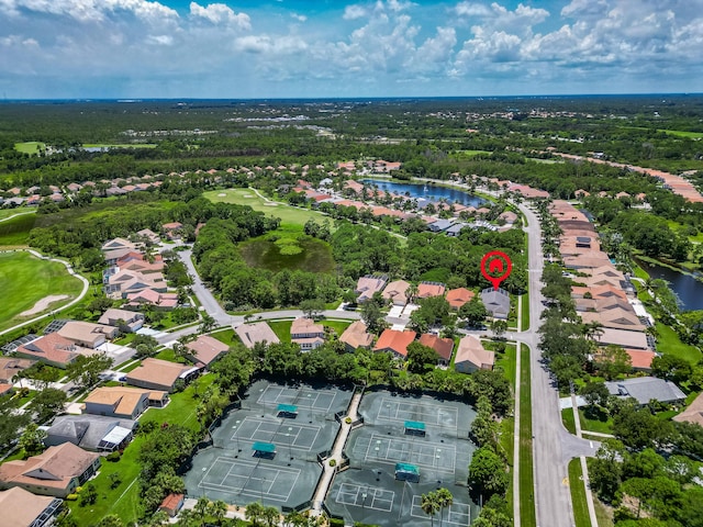 3002 SE Brierwood Pl, Stuart, FL 34997 - aerial overview of property's location with nearby suburban area, a large body of water, and a golf course