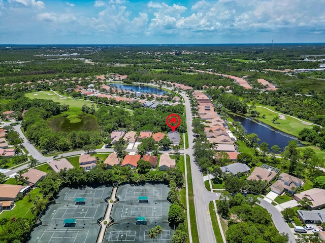 3002 SE Brierwood Pl, Stuart, FL 34997 - aerial view of property and surrounding area featuring a nearby body of water, a local golf course, and nearby suburban area