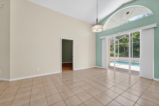 3002 SE Brierwood Pl, Stuart, FL 34997 - tiled spare room with high vaulted ceiling and baseboards