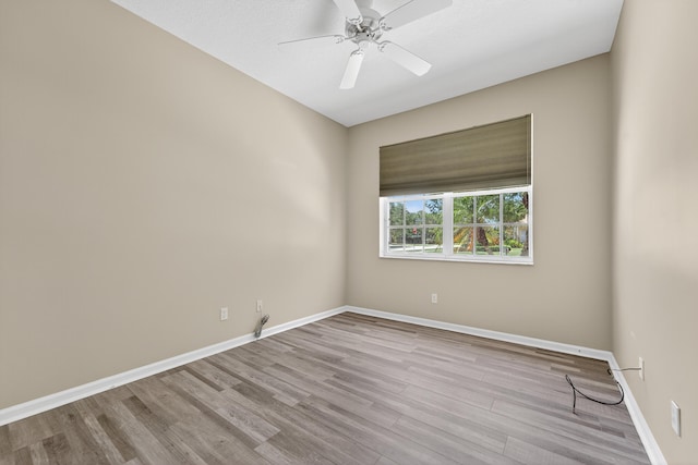 3002 SE Brierwood Pl, Stuart, FL 34997 - spare room featuring wood finished floors and a ceiling fan
