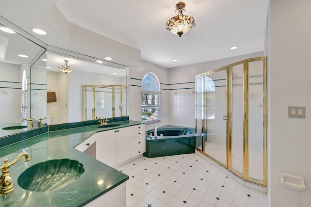 163 Pepper Ln, Jensen Beach, FL 34957 - bathroom featuring a garden tub, a stall shower, double vanity, and recessed lighting