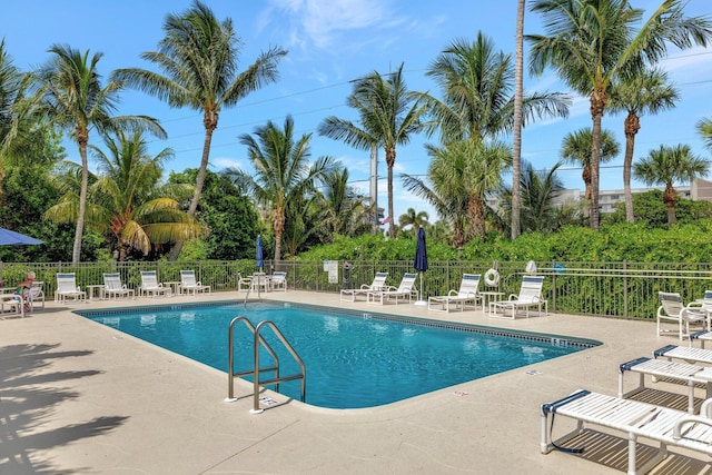 163 Pepper Ln, Jensen Beach, FL 34957 - community pool featuring a patio area