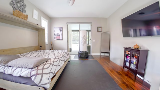 126 Hidden Hollow Dr, Palm Beach Gardens, FL 33418 - bedroom with wood finished floors and baseboards