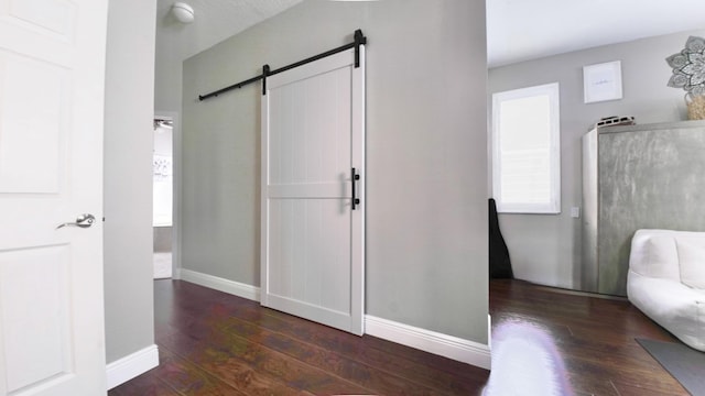 126 Hidden Hollow Dr, Palm Beach Gardens, FL 33418 - interior space with a barn door and hardwood / wood-style flooring