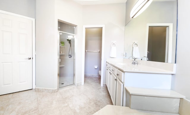 126 Hidden Hollow Dr, Palm Beach Gardens, FL 33418 - bathroom featuring a shower stall, vanity, and tile patterned flooring