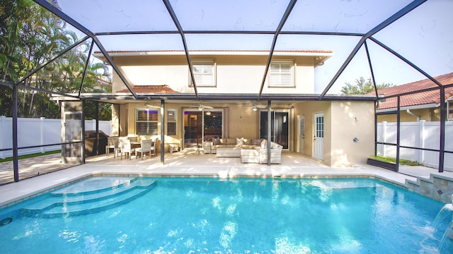 126 Hidden Hollow Dr, Palm Beach Gardens, FL 33418 - rear view of house featuring an outdoor hangout area, stucco siding, a ceiling fan, a patio area, and glass enclosure