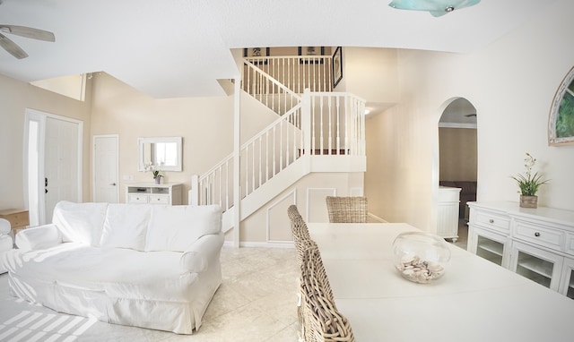 126 Hidden Hollow Dr, Palm Beach Gardens, FL 33418 - dining space with ceiling fan, stairs, arched walkways, and tile patterned flooring