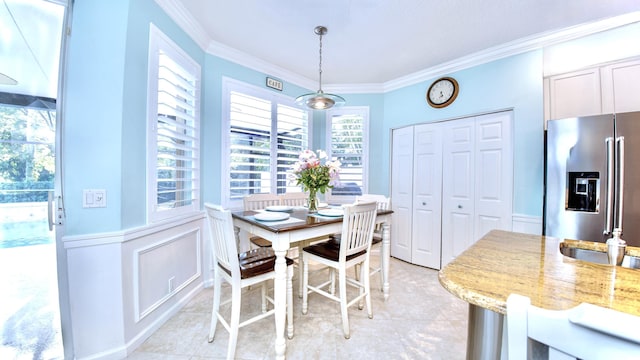 126 Hidden Hollow Dr, Palm Beach Gardens, FL 33418 - dining space featuring crown molding, plenty of natural light, and light tile patterned floors