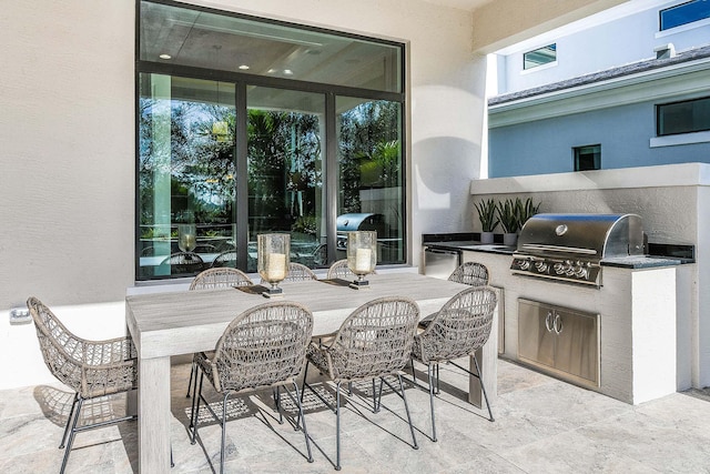13405 Artisan Cir, Palm Beach Gardens, FL 33418 - view of patio featuring an outdoor kitchen and outdoor dining space