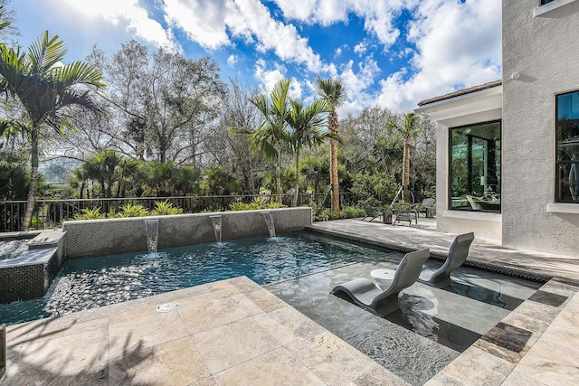 13405 Artisan Cir, Palm Beach Gardens, FL 33418 - view of swimming pool featuring a patio area, a fenced backyard, and a hot tub