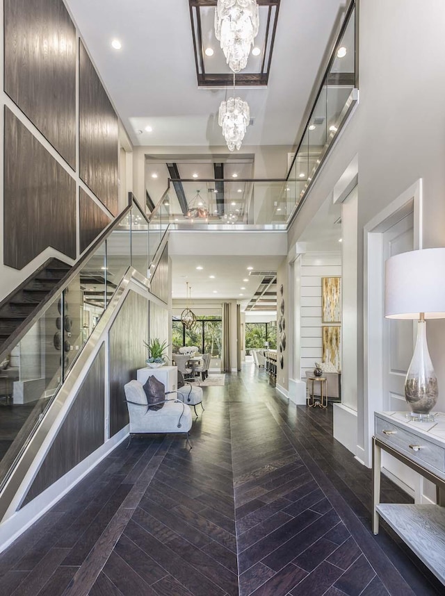 13405 Artisan Cir, Palm Beach Gardens, FL 33418 - entrance foyer with a chandelier, stairway, wood finished floors, and recessed lighting