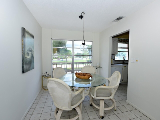 2 Golfs Edge Unit F, West Palm Beach, FL 33417 - dining room featuring baseboards and light tile patterned floors