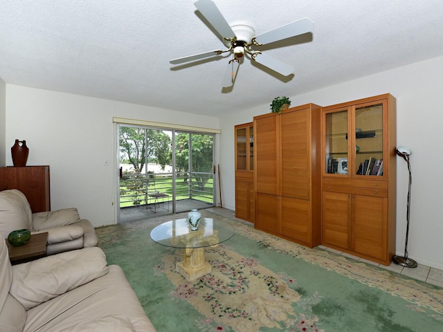 2 Golfs Edge Unit F, West Palm Beach, FL 33417 - living area with ceiling fan and a textured ceiling