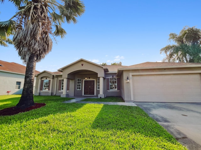 2081 SW Burlington St, Port Saint Lucie, FL 34984 - view of front of property with stucco siding, an attached garage, a front yard, and concrete driveway