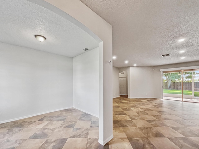 2081 SW Burlington St, Port Saint Lucie, FL 34984 - unfurnished room featuring a textured ceiling and recessed lighting