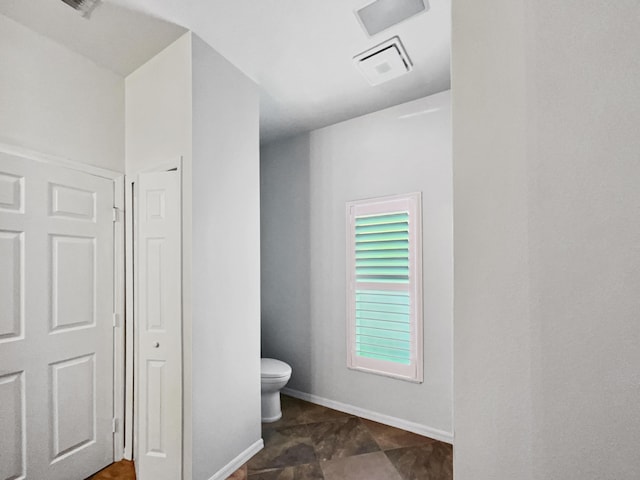 2081 SW Burlington St, Port Saint Lucie, FL 34984 - bathroom with toilet and baseboards