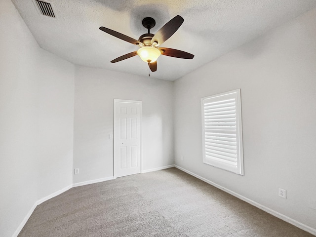 2081 SW Burlington St, Port Saint Lucie, FL 34984 - spare room featuring ceiling fan, carpet floors, and a textured ceiling