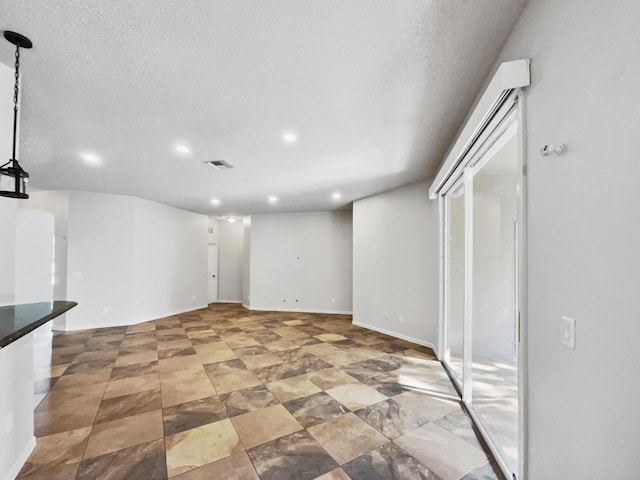 2081 SW Burlington St, Port Saint Lucie, FL 34984 - basement with recessed lighting and a textured ceiling
